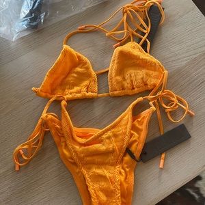 Brand new triangl swimsuit with tags in the vinca/desert style!